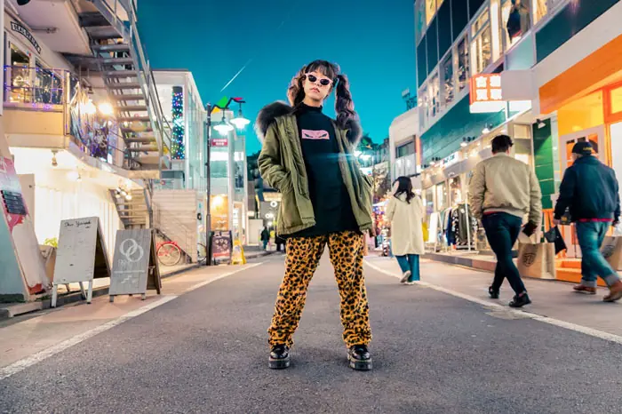 Japanese woman standing confidently in Tokyo street wearing bold leopard